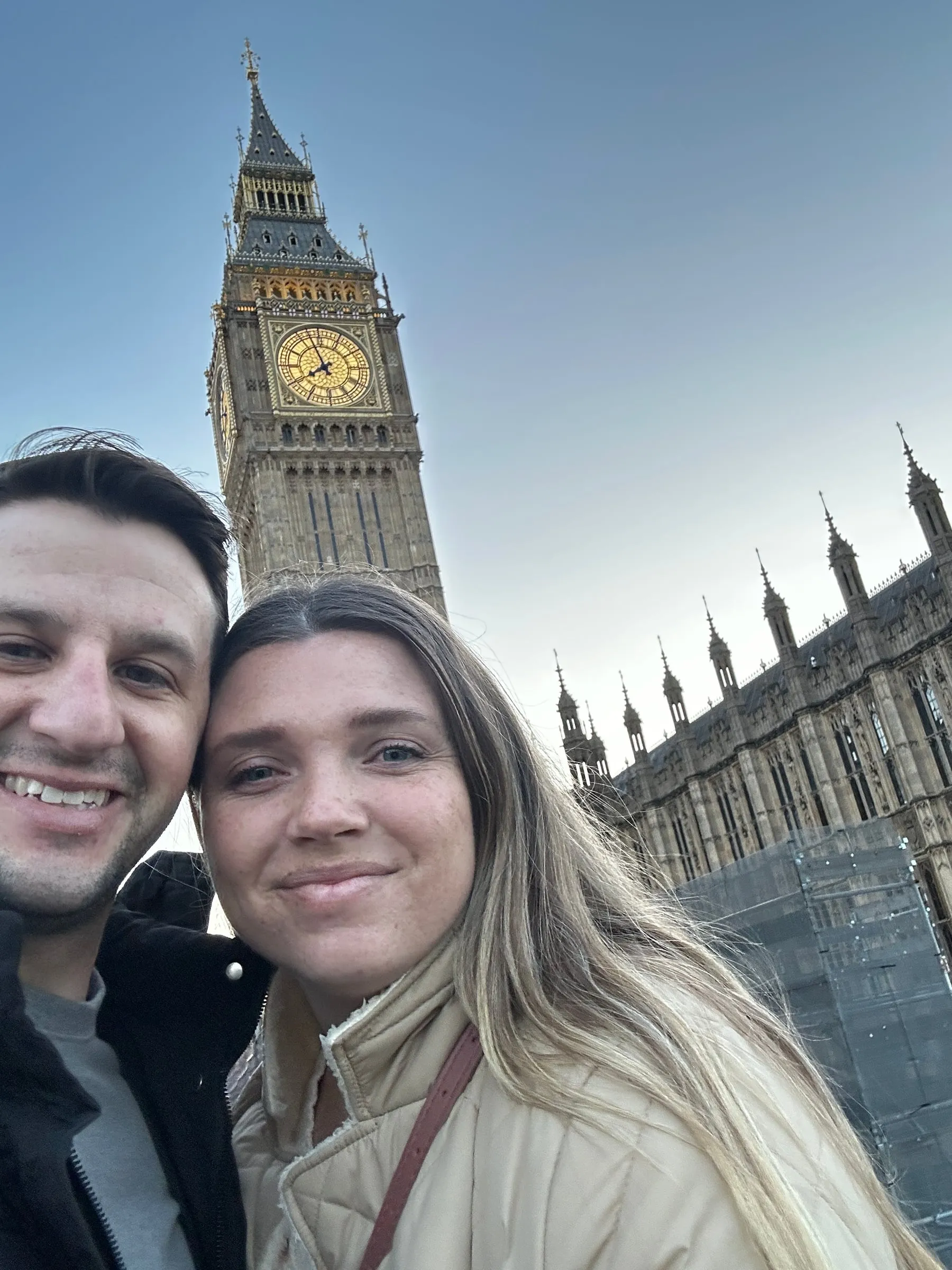 Michael and Chantelle taking a selfie in front of Big Ben and the Houses of Parliament