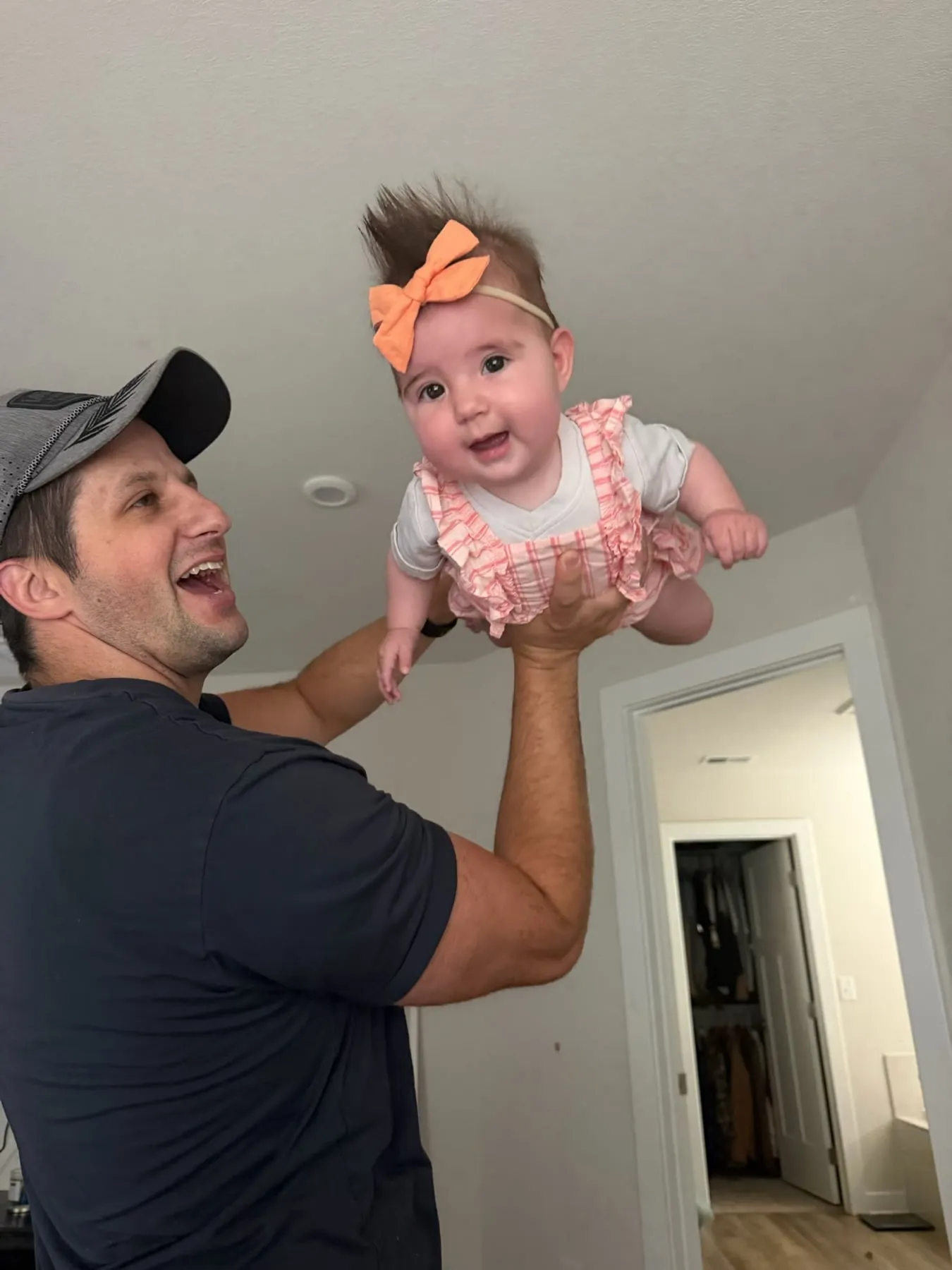Michael lifting a laughing Vienna up in the air