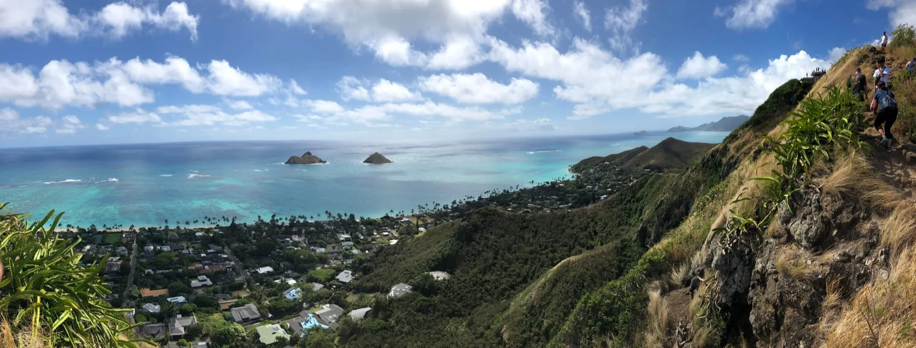 View over Lanikai and the Mokulua islands from a green ridge on Oahu