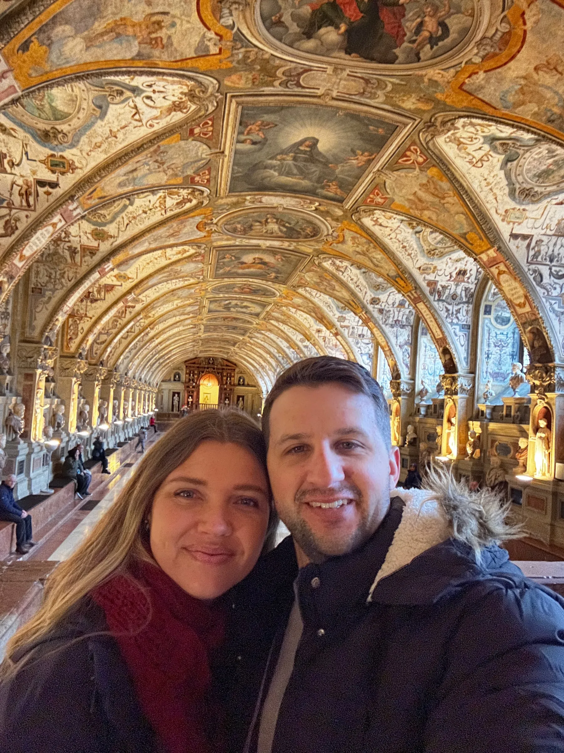 The long, arched Antiquarium hall in the Munich Residenz, covered in painted ceilings