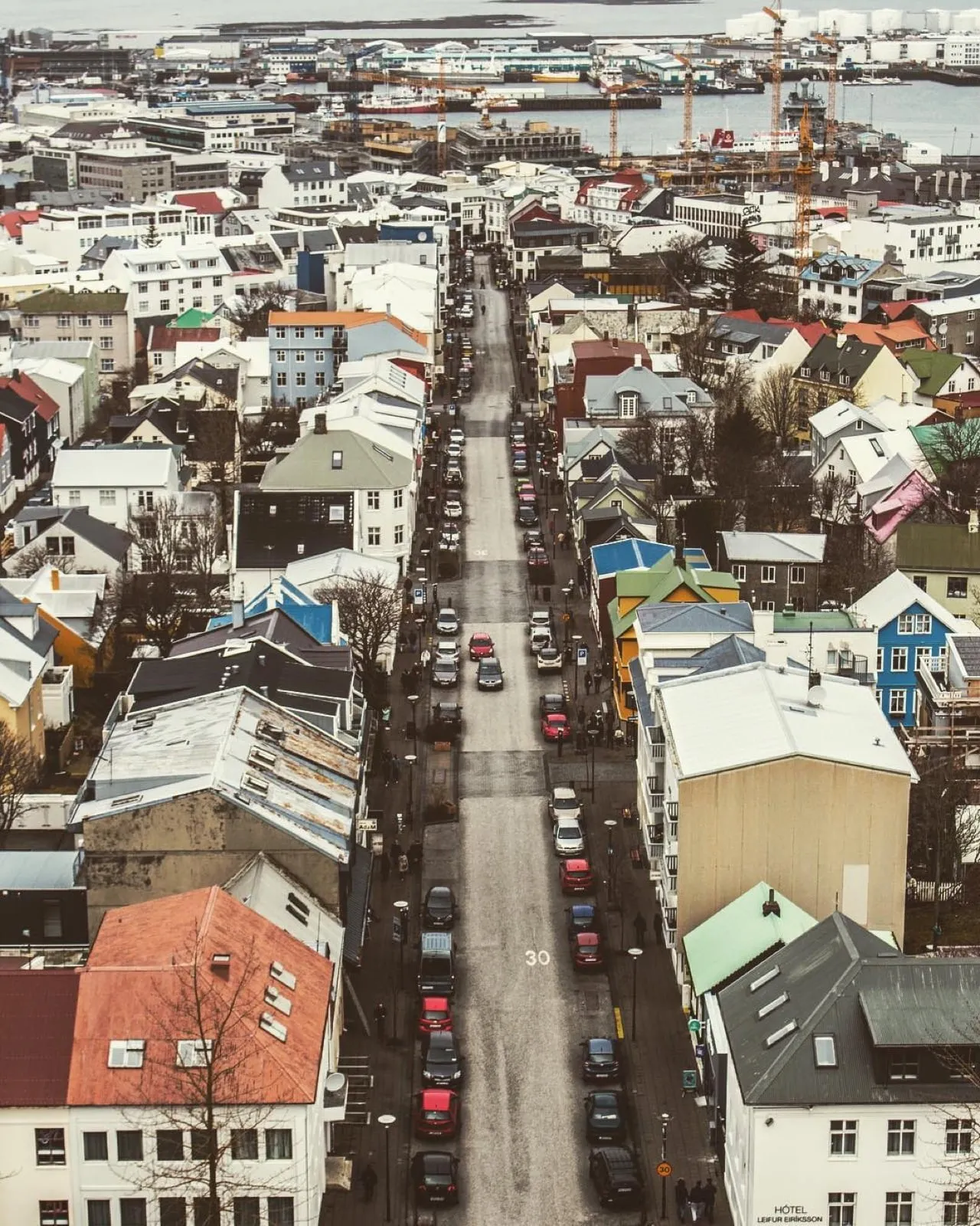 Reykjavik’s colorful rooftops and a long straight street seen from high above