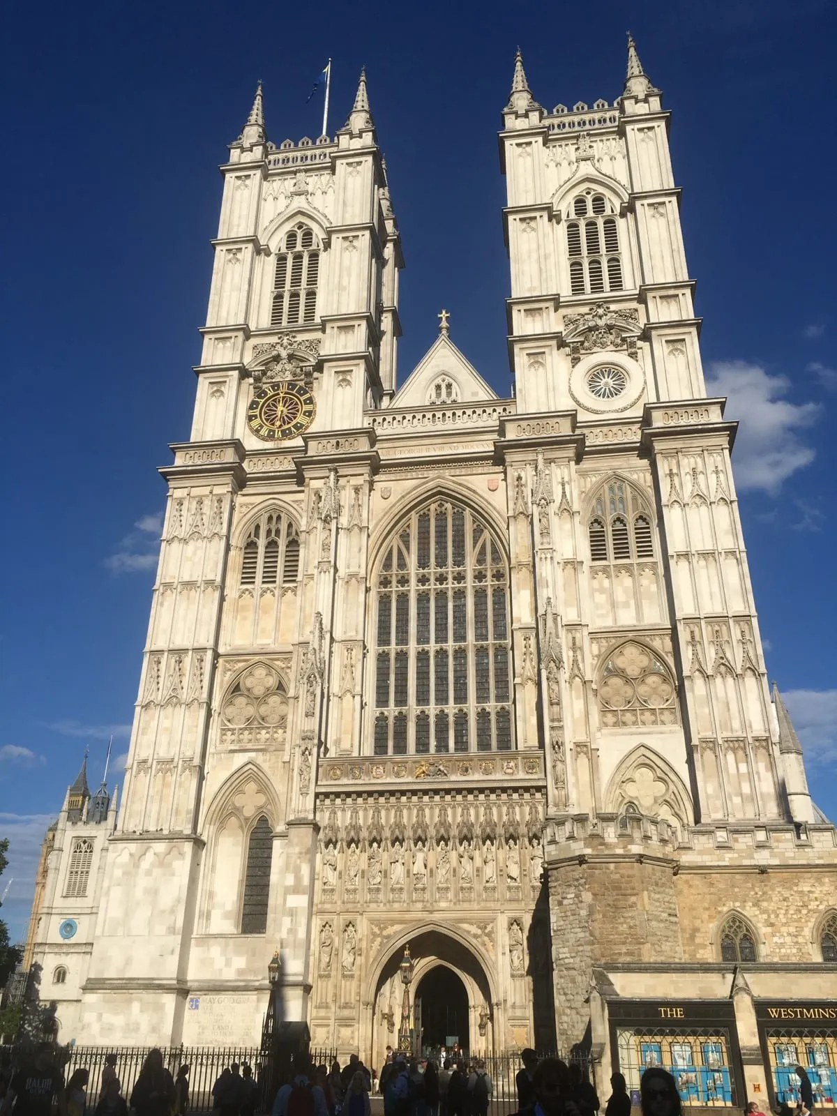 The twin towers of Westminster Abbey against a bright blue sky